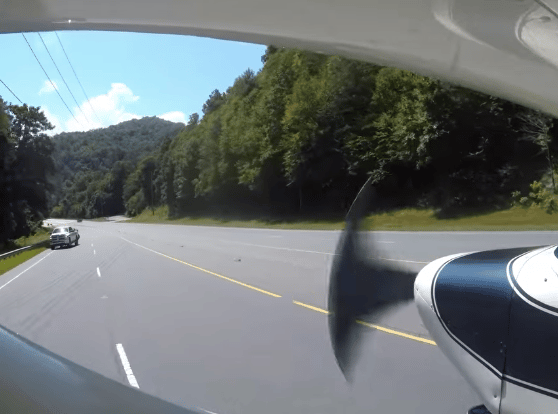 plane avoiding cars on highway