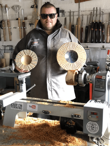 Blind woodturner with his work